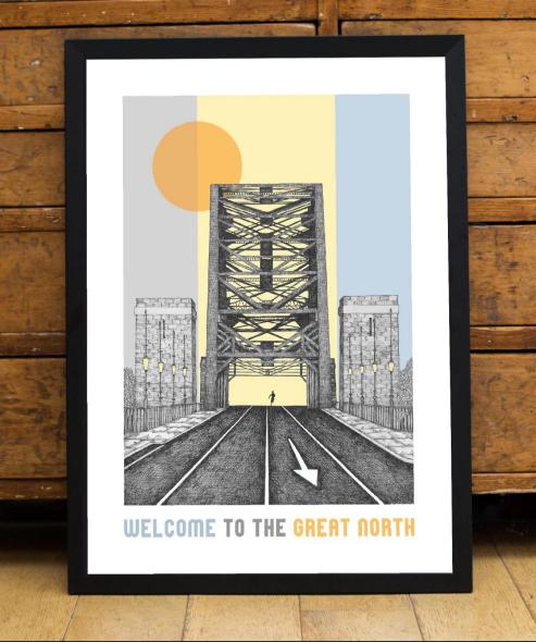 An artwork by Ben Holland, framed and leaning against a wooden wall. It includes the Tyne Bridge, with the sky made up of graphic blocks of colour including blue, yellow and an orange circle. It has a caption that reads "Welcome to the Great North"